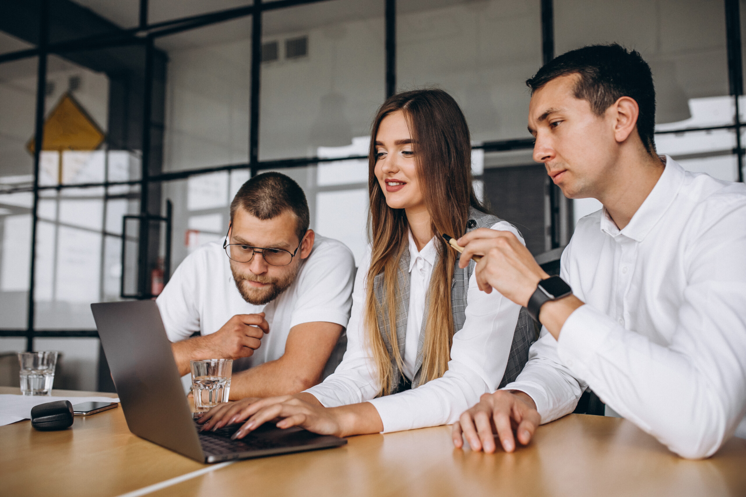 Group of people working out business plan in an office